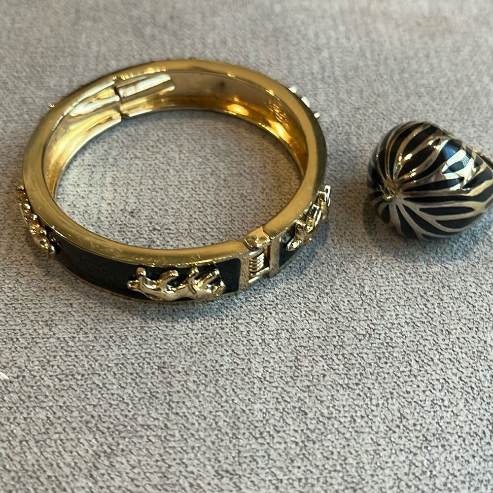 Black and gold enameled jewelry, bracelet and striped dome ring.